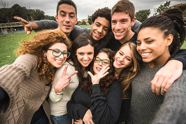 istock Group of college student laughing and doing a selfie 501752918