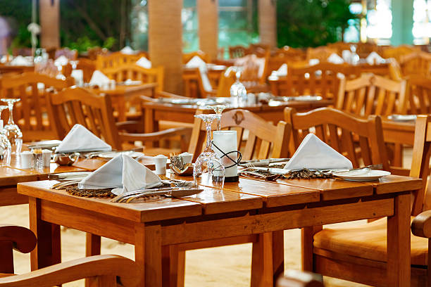 istock Glasses and plates on table in restaurant 501763662