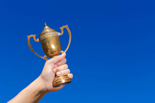 istock Holding the cup with blue sky background. 501766786