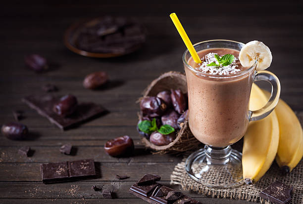 Chocolate banana smoothie with coconut milk stock photo