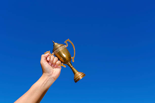 istock Holding the cup with blue sky background. 501768432