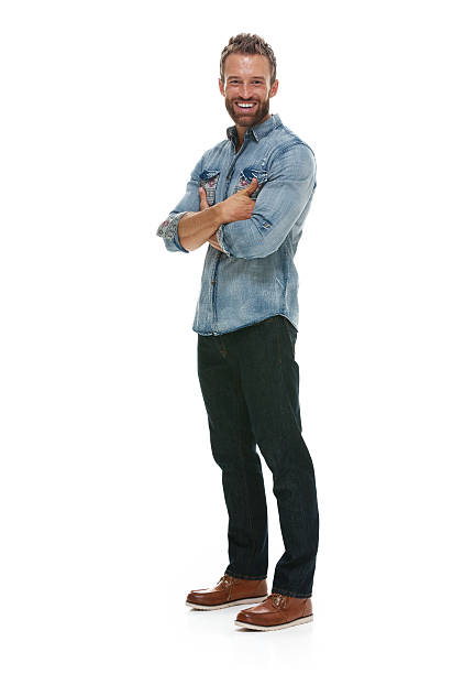 istock Cheerful man standing with arms crossed 501768574