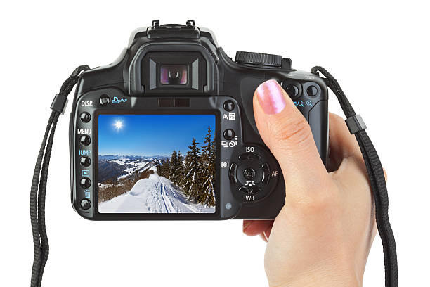 istock Camera in hand and winter Austria view 501769622