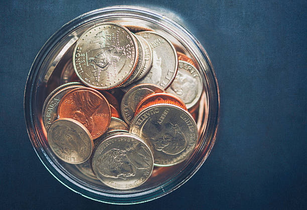 istock Money jar filled with American currency. Savings and donations concept. 501769708