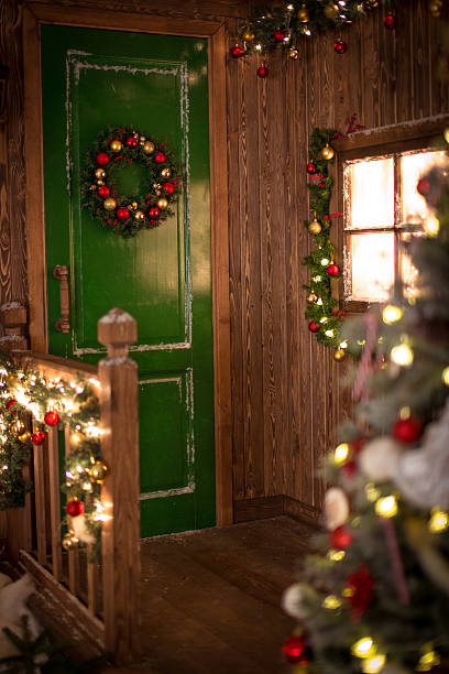 istock Christmas wreath on  green door, a window decorated 501770714