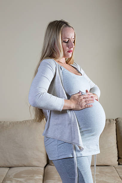 istock pain and discomfort during pregnancy 501771392