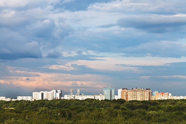 istock blue clouds in pink sky over city 501775095