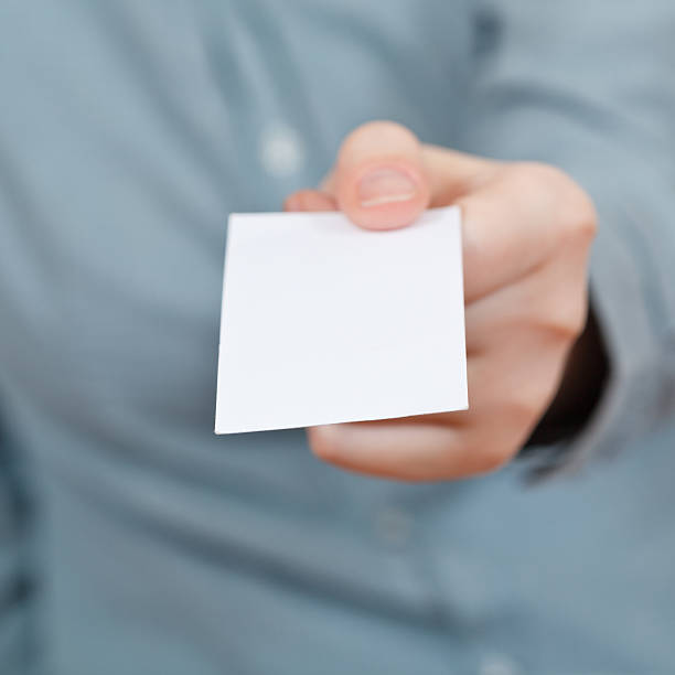 istock blank business card in female hand 501775733