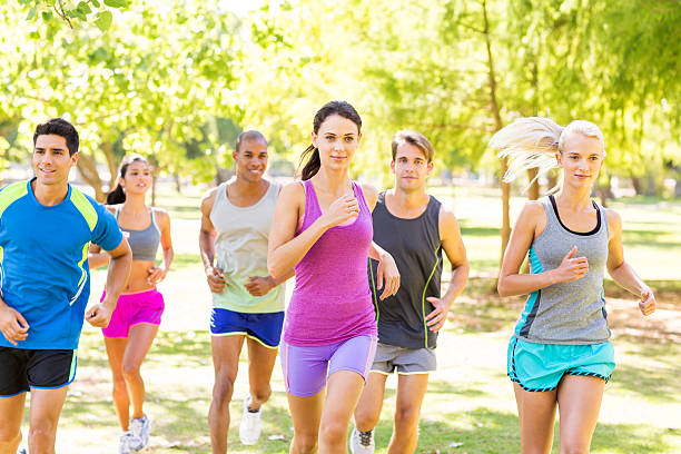 istock Determined Friends Jogging In Park 501776157