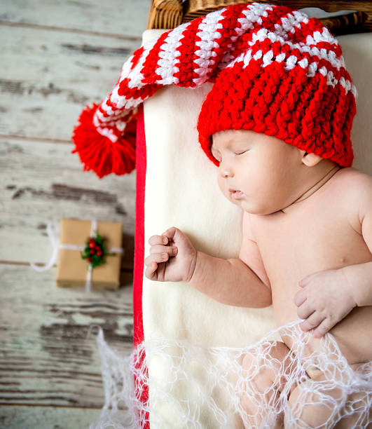 istock sleeping newborn baby in christmas decorations 501776654