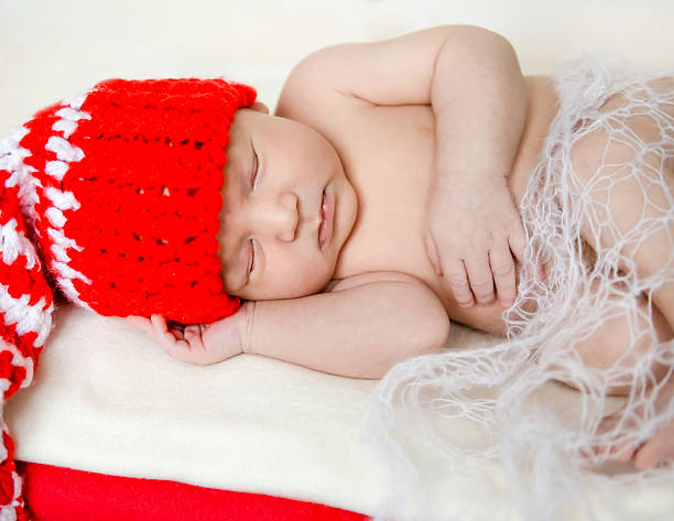 istock sleeping newborn baby in christmas decorations 501776704