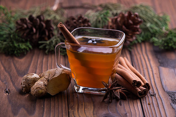Warm drink for winter: tea, cinnamon, star anise, and ginger stock photo