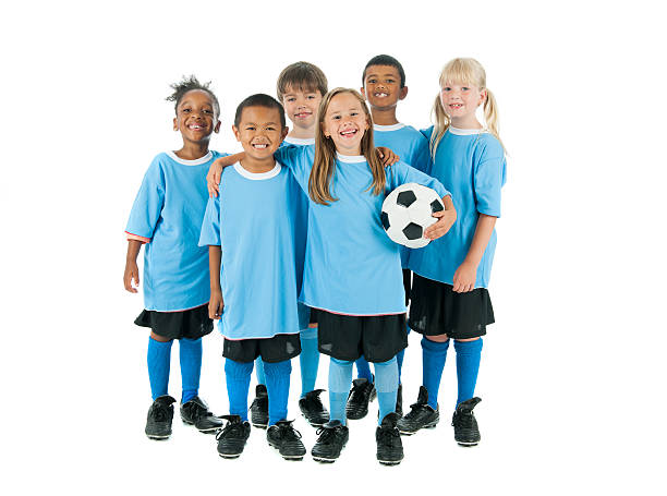 bambini che giocano a calcio - little boys people indoors soccer foto e immagini stock