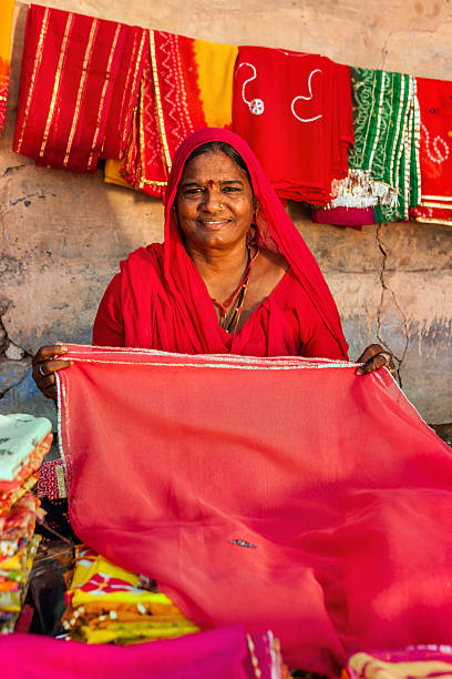 istock Indian woman selling colorful fabrics 501777350