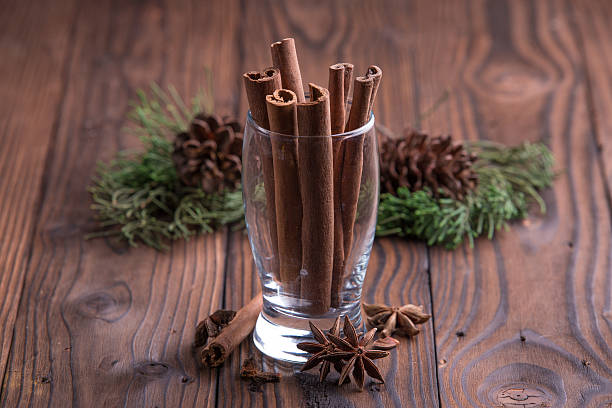 istock Cinnamon sticks and star anise on brown rustic wooden background 501777676