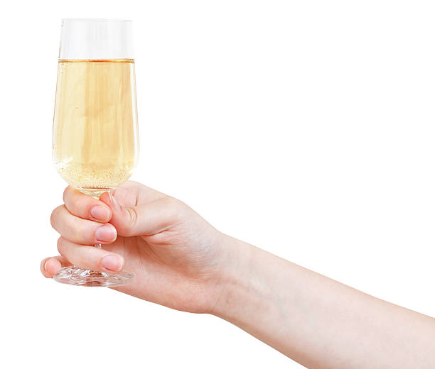 mão segura com taça de vinho espumante - champagne flute wine isolated wineglass - fotografias e filmes do acervo