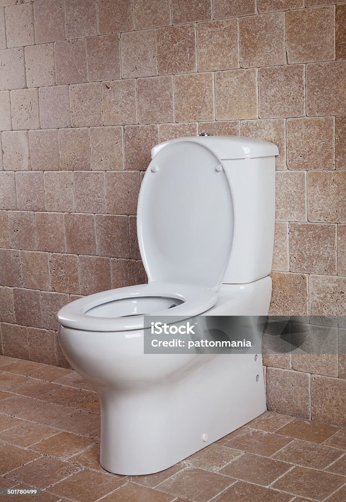 new toilet new toilet on brown tile wall Bathroom Stock Photo