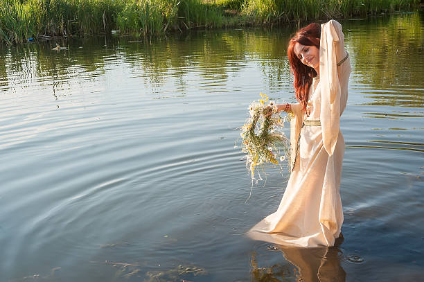 istock Beautiful red-haired girl relaxes in water 501780953