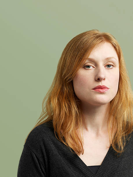 istock Beautiful Red Haired Woman Looking At Camera 501781127