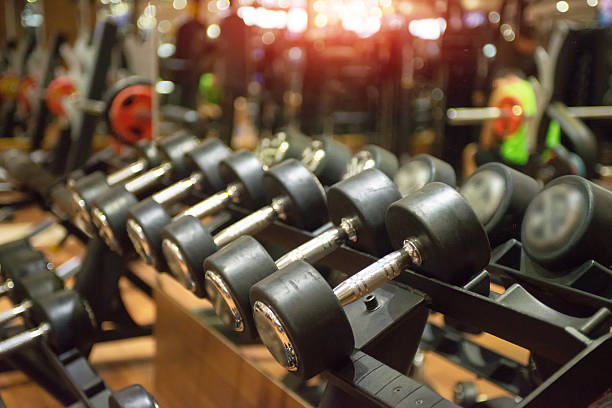 istock Sports dumbbells laid out in a row 501784270