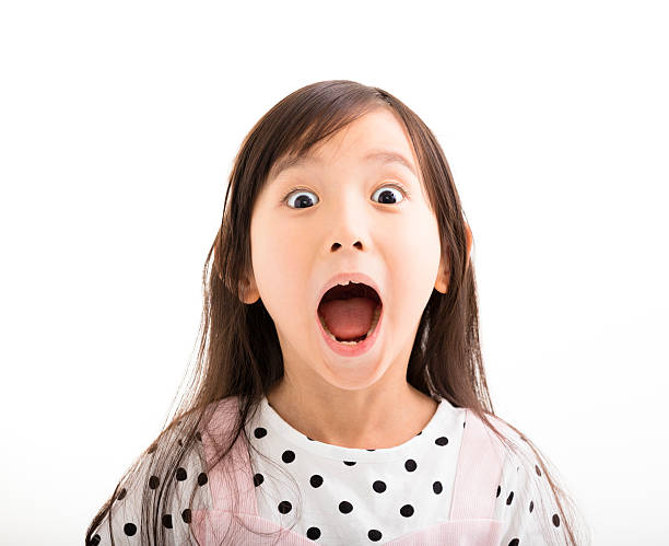 istock closeup little girl with surprised face 501784834