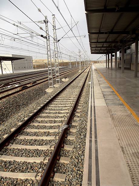 istock Train Tracks Into the Distance from Platform at Railway Station 501786476