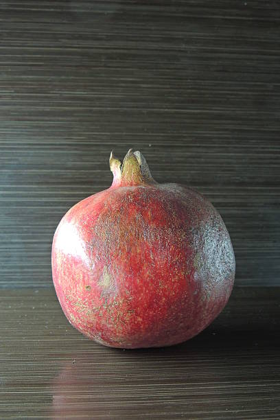 istock Pomegranate on wooden background 501786620