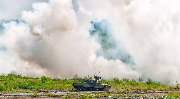 istock Russian tank T-80 making smoke screen from enemy 501786870