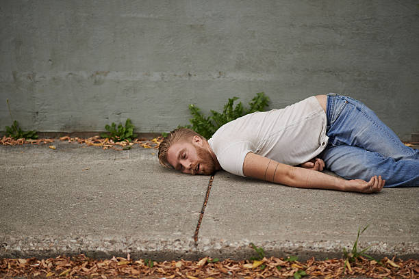 Effects of heavy drinking Shot of a young man passed out in the streethttp://195.154.178.81/DATA/i_collage/pu/shoots/806165.jpg man reclining stock pictures, royalty-free photos & images