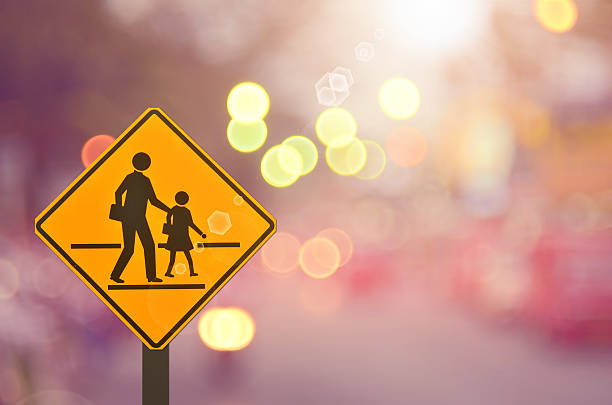 istock School sign on blur traffic road abstract background. 501788282