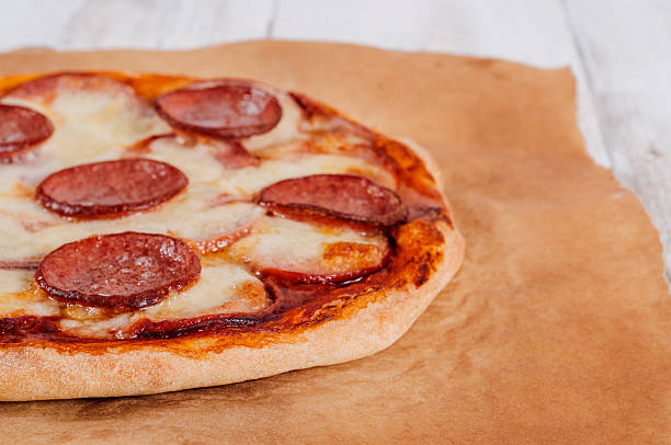 istock Baked homemade pizza on baking paper 501788438