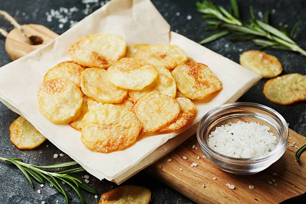 Homemade potato chips with sea salt and herbs