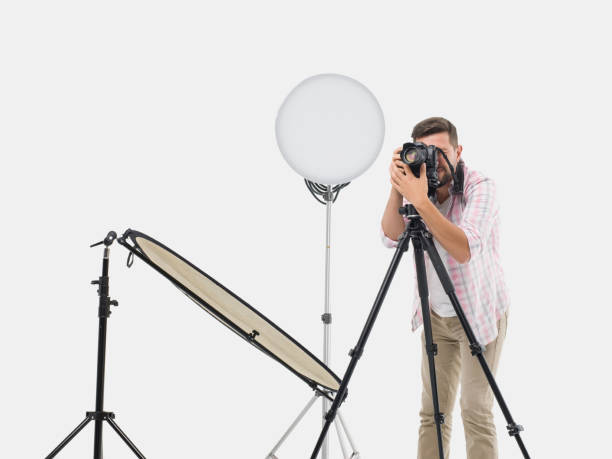 istock Photographer man photo shooting in studio 501792784