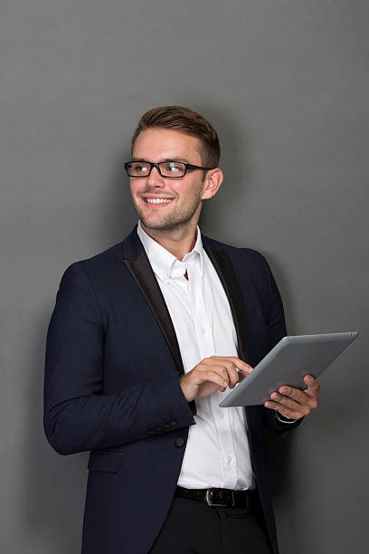 istock Young businessman with a tablet on his hand 501793086