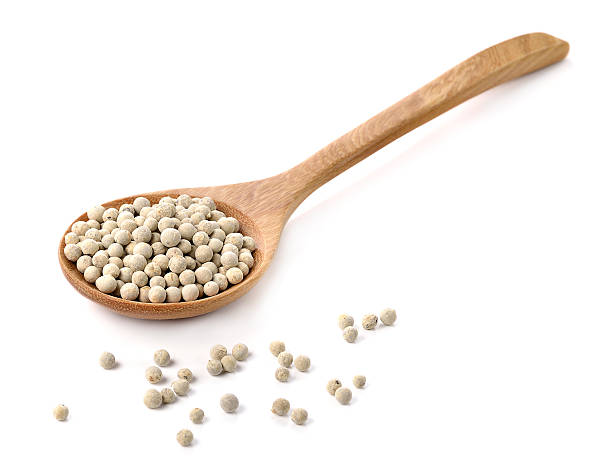 istock Wooden spoon and peppercorn on white background 501793266