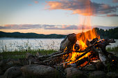 Summer Campfire and Lake at sunset