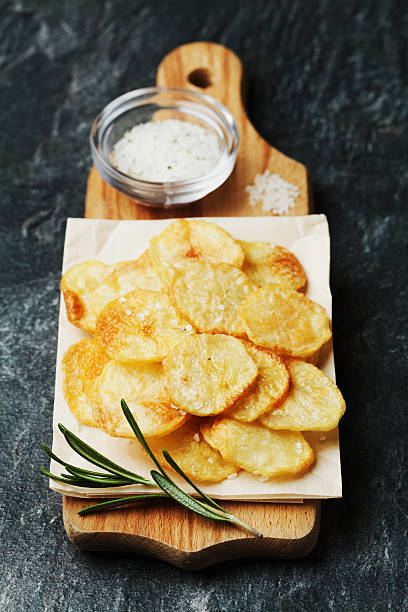 istock Homemade potato chips with sea salt and herbs 501793396