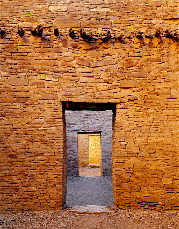 Doorways and glowing walls in the Pueblo Bonito ruin in the Chaco Culture National Historical Park in New Mexico.