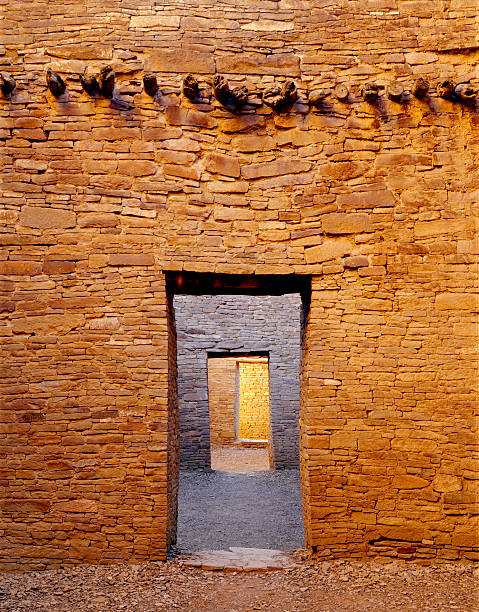 Doorways and Wall, Chaco Canyon Doorways and glowing walls in the Pueblo Bonito ruin in the Chaco Culture National Historical Park in New Mexico. hopi culture photos stock pictures, royalty-free photos & images