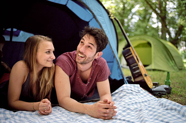 istock Friends outside a camping tent, lying 501793671