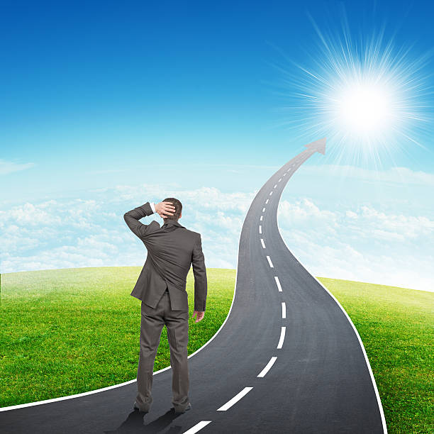 istock Man standing onroadway road going up as an arrow 501794126