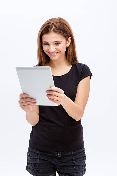 istock Happy lovely cute young woman using tablet computer 501794536