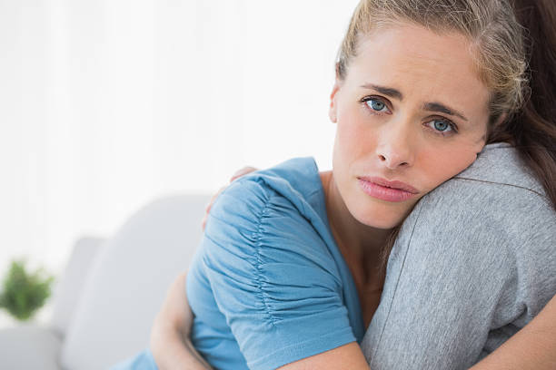 istock Sad woman being consoled by her friend 501795657
