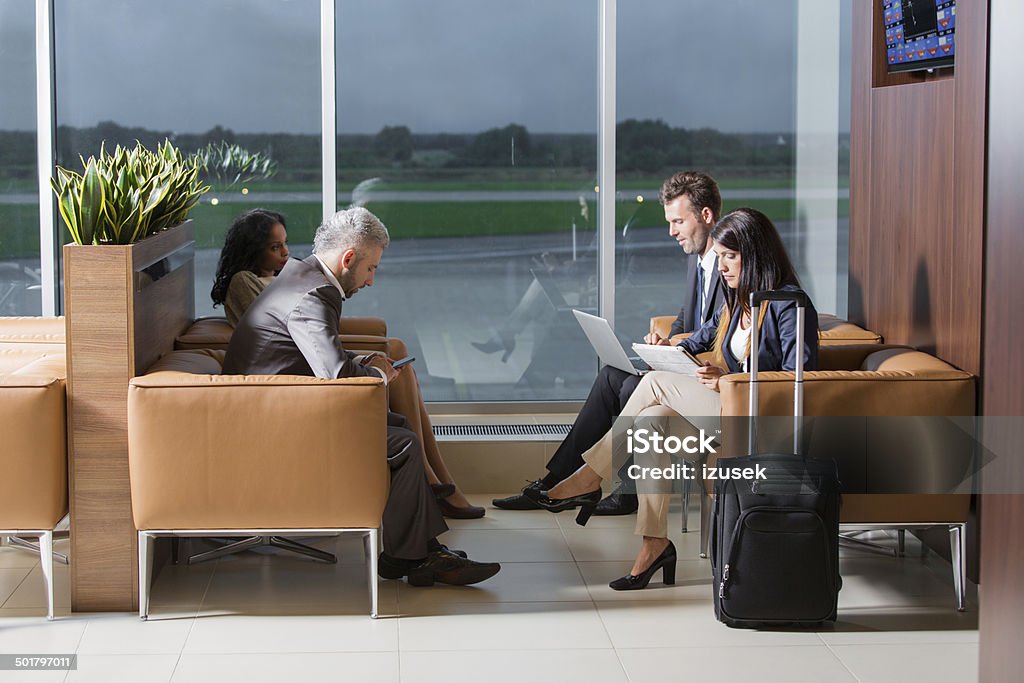 Vip lounge Business people waiting for a flight at the airport vip lounge, using technologies. Airport Stock Photo
