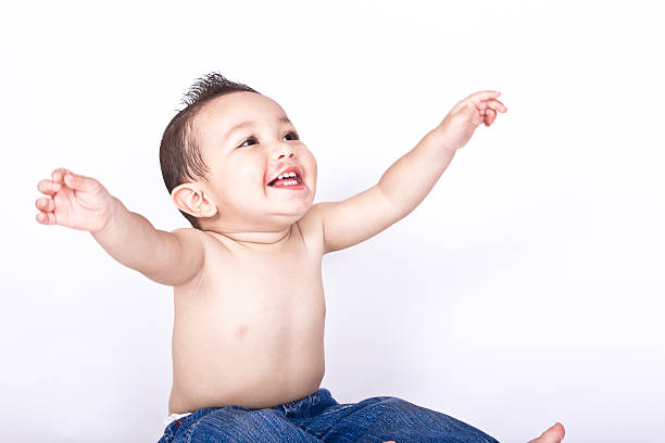 istock Toddler on an isolated background wearing hats 501797063