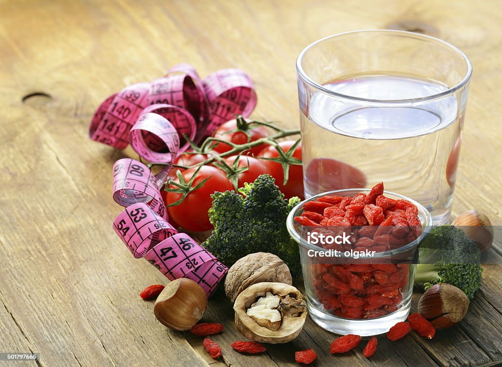 goji berries, water, nuts and vegetables for a healthy diet Antioxidant Stock Photo