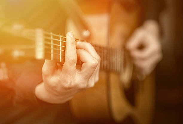 istock Young man play on the acoustic guitar 501798084