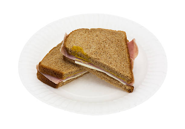 istock Ham and cheese sandwich on a white paper plate 501798246