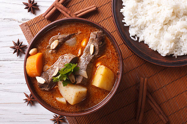 istock Thai beef massaman curry and rice side dish closeup. horizontal 501798712