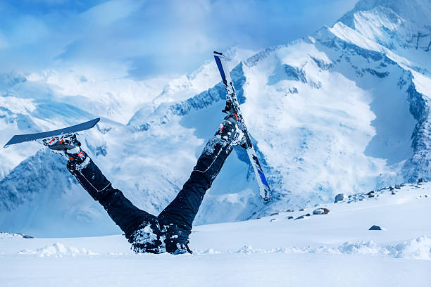 Newbie skier Newbie skier stuck  in deep snow with his legs upside down upside down stock pictures, royalty-free photos & images